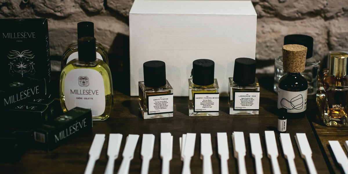RAER Scents perfumes next to Millesève and Maison Incens bottles with smelling strips at a Vetiveria event