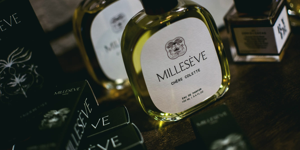 Millesève Chère Colette on a dark wooden table
